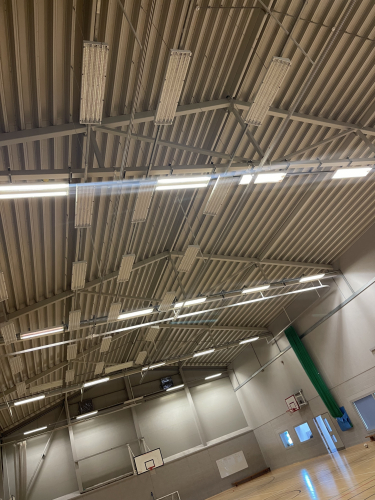 Sports hall lighting 
Sadly the T5s in this sports hall are really dim now and as you can guess the new caretaker want “LED” but I have convinced him to let me quote for both led and for a relamp issue is I don’t know what the fittings are the cricket area is only used a couple times a week and they are really really bright compared to the main lights they have got to be 80W or 49 but impossible to know what. 
