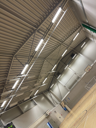 Sports hall lamp up.
Relamped this sports hall although my phone doesn’t pick up just how many fittings were out and how dim it was before I serviced the lights - all new emergency batteries and Philips 80W T5 / 830 tubes got it looking good! 
