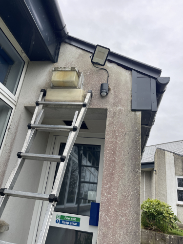 Thorlux bulkheads 1987
The lights around the DT block on this school were a right cluster fuck. They have not worked for a few years according to the site manager before I took this school they were using a local young lad to do the electrics and it shows. He could not get a feed to these lights and in fairness it did take a lot of cable tracing to eventually discover that when one of the ceilings was lowered and replaced the double insulated singles had been put into a whisker box and left disconnected. Once we got power back, it was all easy going and the Philips floodlight on PIR  removed the light that goes underneath the entranceway has been reinstated as he had stolen the feed off of that to power the Philips. New HF ballast needed though good few hours of messing around here. There were more of these Thorlux fittings around the other side but some goon has replaced them for eterna led bulkheads that are well and truly fucked. 
