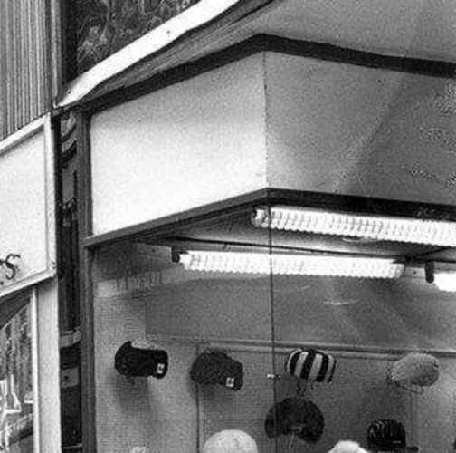 Interesting diffusers in a  Liverpool shop from the 60s
I wasn't sure about posting this due to the grainy quality but it is still possible to make out the fittings with those interesting diffusers. This is a shop in Liverpool city centre during the 60s. One of the fittings has a look of the GEC fitting I have with the curvy lampholders.

