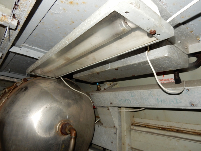 Fluorescent light fitting in the motor/plant car of the Advanced passenger train
This is a 2ft 20w fluorescent light in the motor car of the Advanced Passenger Train (APT) at Crewe heritage railway centre. The adjacent metal box contains a Smart and Brown ballast that operates from 110v dc. APT was a British Rail project during the 1970s- early 80s to develop a tilting passenger train. Sadly it never made it past the prototype, even though many of the early problems had been solved. The project was abandoned in the mid 80s and it is now a static exhibit at Crewe.  
