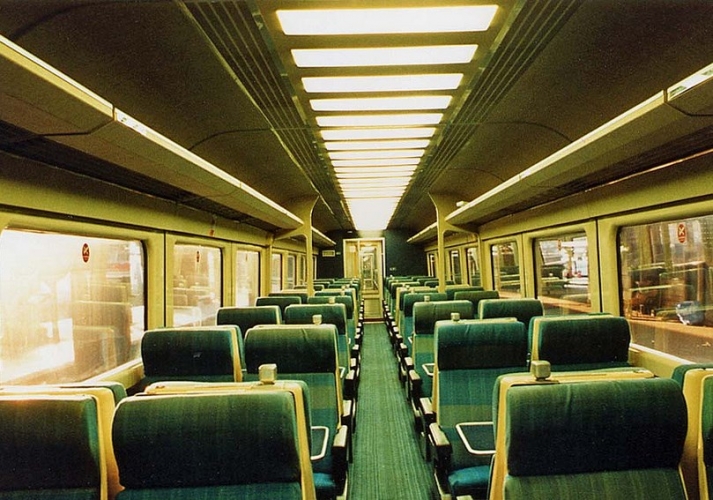 BR MK3 - lots of fluorescent tubes!
This isn't my picture, I rarely travel on trains since the mid 90s, but I have always loved this lighting arrangement with all these 2ft recessed fluorescents neatly integrated into the ceiling panels. This is BR MK3 coach that was introduced in the mid 70s and are still considered an excellent design. These coaches are still in service but have mostly been refurbished/downgraded now. A great example of British engineering when not constrained by management from a non engineering background.    
