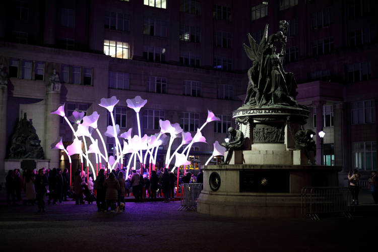 Lighting Art: Interactive illuminated flowers.
I've been going through some of the photo's that I've taken of the various lighting art installations that pop up around Liverpool City Centre now and again.
It's quite hard to take a decent photograph as these installations are animated like cycling through various colours, effects and patterns ect. 
It looks really impressive in the flesh but not so good as a static photo. I've decided to upload a few which gives you a general idea.

I'm not sure what to make of this one. There are a series of large buttons around the inside of the installation which you can press to emit various sounds and drum beats. The lighting in the flowers changes colour and brightness depending on how the "noise buttons" are pressed.
Naturally, when everybody is having at it like mad it just sounds bonkers to me lol.
