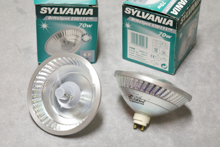 Sylvania BriteSpot ESD111 70w Quartz Metal-Halide 
2 x quartz metal halide R111 lamps in 70w 3000k flavour. Very bright with very good colour and CRI.

I have always been a fan of these R-111 lamps as the dual reflector system means that at no point can the arc tube be directly viewed and 100% of the light emitted by it exits the lamp after being controlled by a reflector.
This allows for very precise beam control with narrow angles with a very sharp cutoff and very low glare.
In fact there is pretty much zero glare unless you look directly into the beam!

As these are a sealed lamp design, these does not suffer from the problem experienced by the open pressed aluminium reflector used on Philips Ceramic CDM-R111's where heat from the lamp causes dust to rise and stick to the reflector which eventually becomes baked on and lowers efficiency.

3850lm (20,000cd)
3000k CRI90
6000h
