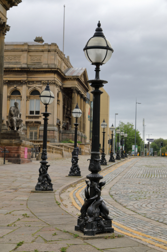 Vintage ornate cast iron columns
The area around Liverpool's Central Library and St Georges Hall has loads of these very ornate cast iron columns around them.
I've no idea how old these are but as the above buildings were built between 1841 and 1860 they are probably from around them!

They are currently warm white so are burning either Philips CityWhite lamps or have been LED'd.

I've found some old photos from the 1850's and they were there then.
[url]https://share.google/images/gvK9XMjK70zXdvp85[/url]

One from the 1890's
[url]https://www.gettyimages.co.uk/detail/news-photo/st-georges-hall-liverpool-news-photo/3093405[/url]

Mad to think they could have been standing there for almost 185 years!

Oh, and if anybody is watching the Netflix show "House of Guinness", keep and eye out as you will see these and the surrounding area in some scenes.
It seems Liverpool is quite popular for filming, it usually stands in for Gotham City!
