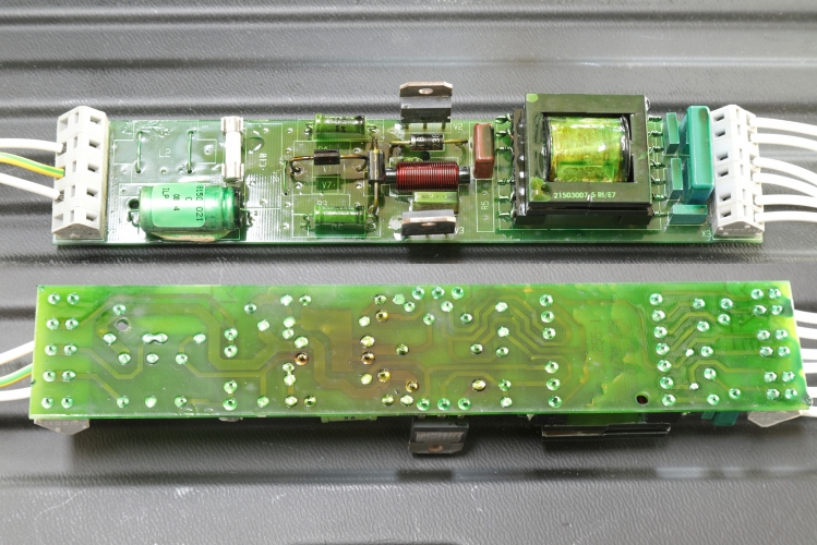 Aqua-Signal 24vDC Inverter PCB
Showing both sides of the board from of an Aqua-Signal 1 1503-007 24vDC inverter for 2 x 20w fluorescent lamps from 1994.
This was very hard to photograph as the conformal coating is *very* shiny and the board has to be placed an angle in order for the reflection not to obscure any details.
The two main NPN transistors doing all the work are some BD249C's.
There are a lot of spaces which have not been populated so they obviously use this PCB layout for other models.
