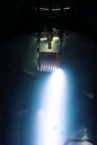 Osram 250w MA/V: Full power electrode.
A close up photograph of a 250w Osram medium-pressure mercury lamp operating at full power.
Not something you get a chance to see every day!

There is the tiniest streamer visible which is making a beeline for the starting electrode above the electrode between the two lead wires.
