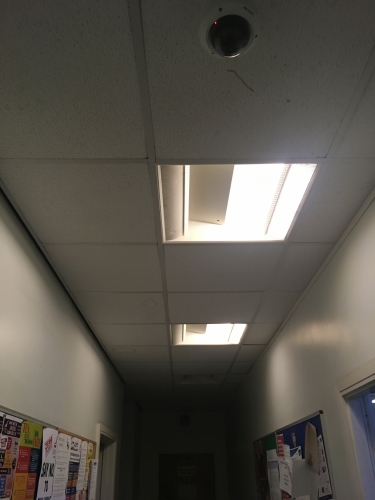 Awesome maintenance part 2.  
The corridor at work that leads from the break room to the toilets...
A lot darker than it looks! 
Two luminaires out totally and the other two half lit!
