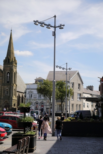 Unknown Lanterns and columns.
The main Castle Square in Caernarfon, so named at its right in front of the Queens Gate of the Castle, is lit by loads of these.
Not sure who makes them or what lamps they burn but they look quite cool IMO.
