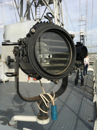 Warship signal lamp.
One of several signal lamps aboard the Town Class Cruiser HMS Belfast.
The handle at the top left of the unit operates the shutters so you can flash out messages.
Nice big halogen inside it.

