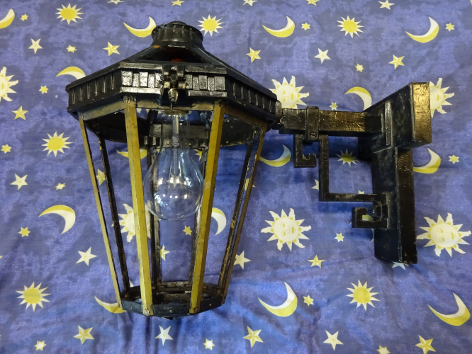 The Revo B9504 has a lamp!
Slow and steady progress on this elderly Revo B9504. Since first acquiring it, I've been carefully working on it to prepare it for restoration. in this case its largely involving replacing missing components such as the 42 4BA screws for the glass clips, and 8 3/16" BSW screws for the lower glass clips. Of course, I chose brass so as to not introduce more different metals into the mix.

The glass amazingly is still made today, so I've opted to replace all 17 panes of glass for new owing to the fact that only two pieces were original, and the replacements fitted were poorly cut and in some cases didn't even fit properly.

This now left the lamp holder and a bracket. After carefully comparing, I deemed the lamp holder bracket in the Simplex well glass light as close a match I'll ever find, but even that needed some slight alterations so it would fit the way it would need to. I asked Jonathan whether he could create a 3D file to 3D print a new bracket taking into account a slight difference I needed in one measurement. As you can see, the prototype printed out is replicated absolutely perfectly, without a flaw whatsoever. I tapped the holes to receive the screws and screwed it all into place. Fitting a lamp, the lantern is already looking totally transformed.

I'm now in the process of having the bracket 3D printed in metal, as intended. 300w lamps are no joke when it comes to heat. Once the correct Brass sheet arrives, I can begin the task of bending and cutting the brass to the correct shapes to make the clips, and then I can strip down the lantern where needed to begin it's proper (and correct) restoration.
