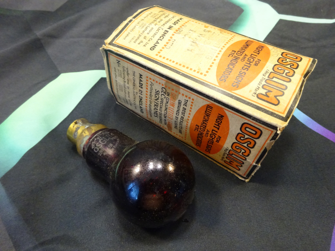 Osglim 6w beehive lamp, with sleeve.
This was found in an antique shop whilst on holiday by my mother, and as soon as I took it out the sleeve, I knew I had to have it!

By memory, this is a specialist lamp from 1942 made for darkrooms, the lamp being coated in a thick red lacquer to further dim the lamp down (as though it really needs it from neon....) Interestingly theres two etches on this lamp, one at the end beneath the lacquer showing 07 date code, and this one on the paint showing 11 as its date code.

I'm yet to power it, much like the other lamps I'd like to bring this up slowly on a variac rather than just showing 240v straight into it.
