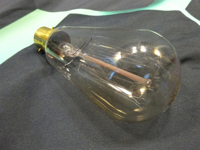 Mazda squirrel cage lamp.
I picked this up today from an antique fair of all places. It was on a table full of other bits and pieces, in a old but very good condition Royal Ediswan box. I looked into it to see this lamp, and thought I'd best get it to compliment the older Osram lamp I'd picked up prior to seeing this.

This is obviously a much later lamp, having no pip, and a smaller brass lamp cap. Interestingly its also only 210v, so yet another lamp I'll be using on a variac rather than just putting it straight onto mains supply.
