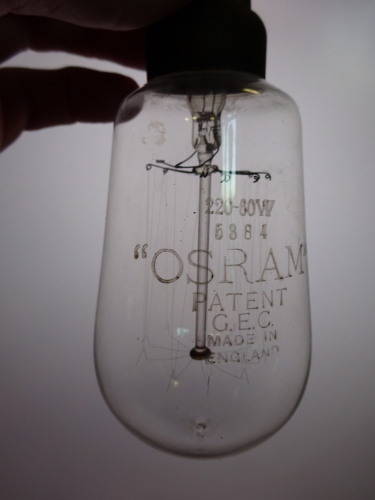 Osram vacuum squirrel cage lamp, etch.
I picked this up today from an antique fair of all places. It was on a table full of other bits and pieces, in a old but very good condition sleeve. I looked into it to see this pip, and immediately knew it was something I needed to get. 

Getting back home, I was able to inspect it closer, and holy hell is this lamp beautiful. The etch is massive, it was also very faint so I filed down and rubbed some pencil lead into it which brought out its detail very well.

I've held it up to my screen to further show the detail. Its believed to date to between 1911 and 1913, meaning this will be my oldest working lamp, indeed the oldest item I have in the collection! Since its 220v though, it will not be lit without being on a variac, something this old needs to be brought up to light slowly rather than quickly, the shock of having power would literally kill it.
