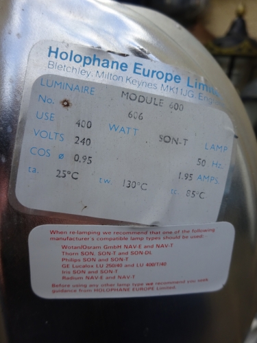 Holophane Module 600 labels
Removed a few weeks back, and subsequently saved, this absolute monster of a bulkhead, a Holophane Module 600, for 400w SON lamps. It came from the former Walsall Market, and was once one of five that lit the area. The area has since been redeveloped, and by the time we eventually removed them, there was just two left. Of those two, this was the only intact one. It was originally mounted on a ten meter column, and was attached to a mounting plate that was just as heavy as the bulkhead itself, believe me it was no easy feat getting it off and into the bucket. The bracket was taken off, as I prefer these wall mounted.

Upon opening it, one of things that I noticed was the label, confirming model number. one thing that took me back though is the lamp manufacturers mentioned, Thorn, Wotan and even Iris, proving the bulkhead really is as old as it is.
