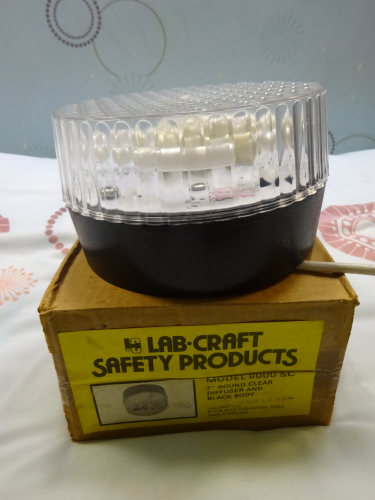 Labcraft 8000 SC bulkhead
I bought this Labcraft 8000 SC bulkhead some years ago now as a shell, with no gear present at all. It appears it was intended to be some sort of emergency light, but with nothing within, a shell is how it remained for years, until last weekend when I done a small bit of cutting and altering to allow a 2D lamp holder to be fitted.

It now runs a 16w 2D lamp, and it looks like the bulkhead was always intended for the lamp, seeing as it fits so snug within. Size wise the bulkheads seven inches round, a similar diameter to the Thorn Rondo. Seeing it light for the first time after all these years is something I'd always anticipated, and it looks as good as I imagined. The front dimples actually magnify and spread the light, meaning its one impressively bright fitting, spreading light very evenly.
