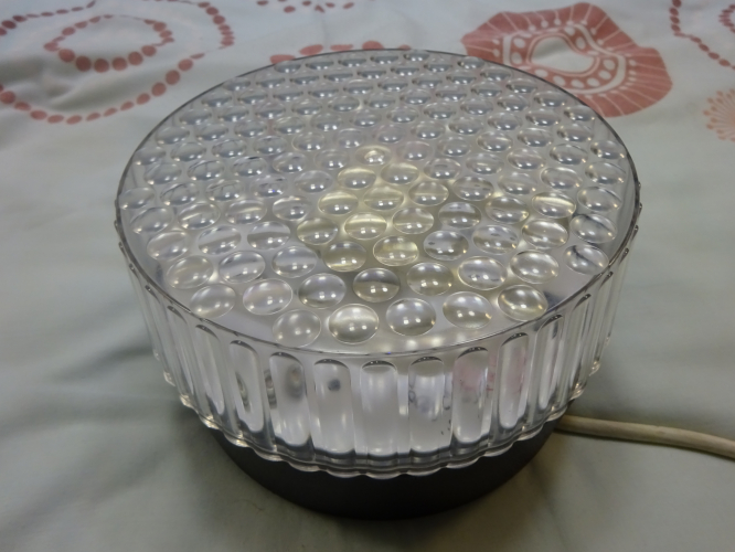 Labcraft 8000 SC bulkhead
I bought this Labcraft 8000 SC bulkhead some years ago now as a shell, with no gear present at all. It appears it was intended to be some sort of emergency light, but with nothing within, a shell is how it remained for years, until last weekend when I done a small bit of cutting and altering to allow a 2D lamp holder to be fitted.

It now runs a 16w 2D lamp, and it looks like the bulkhead was always intended for the lamp, seeing as it fits so snug within. Size wise the bulkheads seven inches round, a similar diameter to the Thorn Rondo. Seeing it light for the first time after all these years is something I'd always anticipated, and it looks as good as I imagined. The front dimples actually magnify and spread the light, meaning its one impressively bright fitting, spreading light very evenly.
