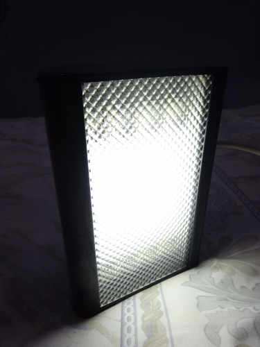 Quad 4w bulkhead build - Complete and lit.
Last month, a collector gave me a 6' fluorescent shop sign light, my intentions is to use that as a light for down the side of my lanterns shed. However one thing did put me off it, the fact it was about 19cm too long. I decided to cut it off, really tidying the fitting up, but then looking at the offcut, I wondered if I could make a second light from that.

After 3 weeks, this is the result, a quad 4w fitting. I had initially debated twin 9w PL, and even 10w 2D, but the latter is too rare now, and there's plenty of 9w PL fittings around. I have quad 8w bulkheads and have built a quad 6w fitting too, but a quad 4w isn't something I had yet made, hence my decision.

To build this, I had to cut two new end pieces to fit, and also design, cut and bend a piece of metal to form a gear tray with which the four tubes will be moved away from the diffuser, whilst also giving enough room for the gear to also fit comfortably too. It's definitely one of my most tightest and compact light builds to date, but its output is really evenly spread and controlled, even going as far as making the 4 tubes look like one even area of light.

When lit, despite being quite bright, it isn't glary in the slightest. I love the way the tubes all merge together to become one uniform area of light, the line of the tubes become almost indistinguishable. Perhaps the most surprising part is heat barely even builds up, however owing the type of metal that's been used for the shell, means its heat dissipation is superior.

This has to be one of my most favourite creations yet, and hopefully very soon when we find the right one, its to be installed on the front of our house illuminating the number of our house, so will see plenty of good service!
