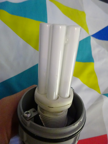 Castaldi Polo bollard - Lamp
This is how the lamp is orientated within the bollard, it just simply stand upright. To get to this point, it requires a hell of a lot of dismantling. First you have to screw in the two screws beneath the lens to release the lamp and gear housing from the bollard. Then you unscrew those screws you've just tightened up to remove them out the housing completely. Then you have to take the top cap off, and then you can pull the lens off the gear housing. Then above the louvres you have to unscrew two thumbscrews to release all the louvres, allowing you to finally replace the lamp.
