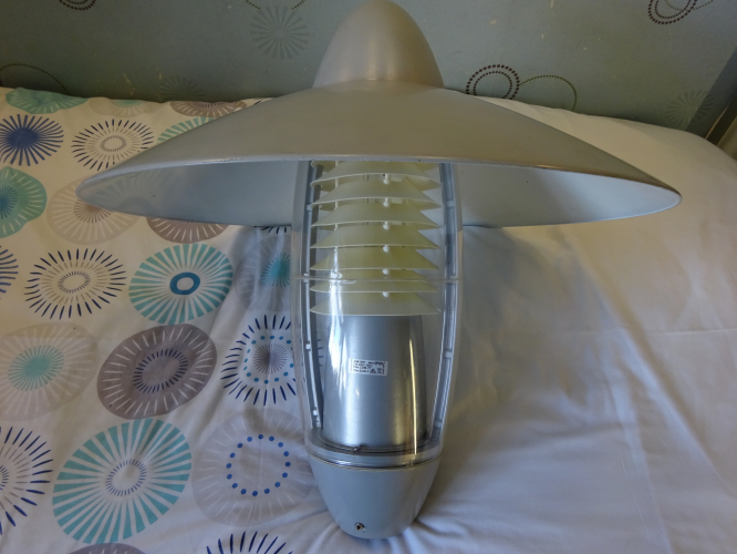 Concord:Marlin Skyline
This Concord:Marlin Skyline is probably one of the most modern looking post tops to arrive in the collection. It also goes down as being probably one of the most tedious lanterns I've ever stripped down to clean ever. The whole job took over an hour to disassemble, clean and reassemble.

Despite being a tedious lantern to work on, It's a well built and very overengineered lantern, and it does has some redeeming points. To access the lamp you undo two screws at the top, and to access the connector block, you undo two screws on the base. Good luck accessing the gear though, as you'd need to totally disassemble the lantern. The thing that really lets it down for me is the plastic louvres, as you can see they've only just started going yellow here, but even so they were painfully brittle in places.

It came with a Cosmo lamp, however I decided to try and be a bit kinder to the louvres and put a slightly cooler burning SON lamp in it instead. It looks really nice when lit too, and downwards light is excellent. The over reflector has definitely played a part in preventing the louvres from yellowing quicker, so this will be retained.
