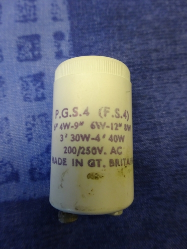 Coughtrie SFB8, starter
For years, the Coughtrie SFB range has been a staple seller for the company. Designed around the mid to late 60's, these boasted an ultra slim, sleek design, with many lamp options available. The bulkheads even won design awards. 
The SFB16 is by far the most common version around, the SFB32 being a solid second. The SFB8 however was a totally different kettle of fish. Taking only one tube, it really wasn't a popular version at all, despite its energy efficiency back then, even to this day. The design never remained in production long, and you'd be hard pressed to even find an example installed and working.
A very lucky spot secured me this brand new old stock example, and despite the box showing signs of damp and very rough storage, the bulkheads practically mint inside. It came with an original tube, and its original moulded starter. At some point in its past, the rear entry had been punched out, telling me there was plans to install it, but they never materialised. Therefore I gave it its first bit of power, as you do. It started immediately without no trouble and is silent when running, as is usual. Definitely my favourite bulkhead from 2018.
