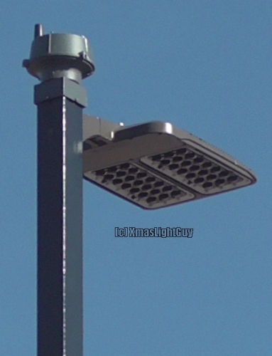 StreetLight #355 - Waffle Iron?
Yet  another parking-lot that was converted to LED...these look like someone stuck a waffle iron on a pole... .lol.

That 'photocell' looks like its one of those wireless 'smart' controllers too.

Location:
Shopping Center near Wadsworth & 1st, Lakewood, CO
