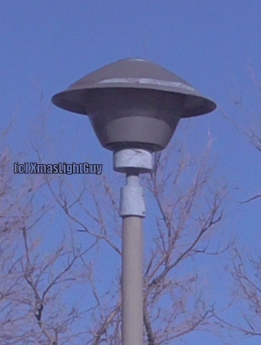  StreetLight #357 - Old PostTop
A post-top fixture that looks to be fairly old, (and a design I haven't seen other than in thin one place)

There's a parking-lot that has 3 different type of cool old post-tops in it (this being one of them)

I had been meaning to get a pic of these for some time, but its always busy there (and a place I don't go by all that often), so I never bothered until late last year. 

Considering the way LEDs are quickly taking over everything, I figured better snap a pic while I have the chance...before these disappear.

I wouldn't be surprised if these were MV in their original state(they're SON now) . Could be as old as 1969 - when the building was done.


Location:
3333 S Bannock St, Englewood, CO
