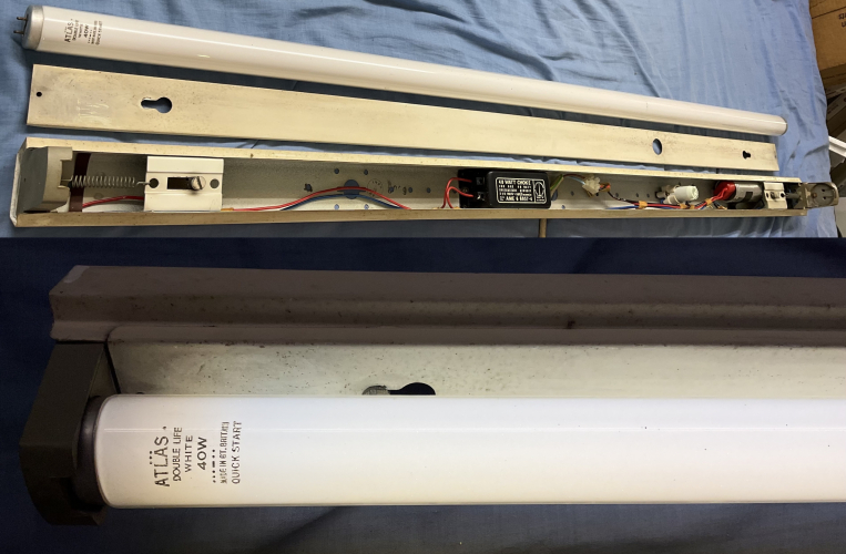 4ft 40W T12 Switch start Atlas Superslim Popular pack batten & Atlas 40W Double life White fluorescent tube
found this a while back in the back of the garage of the seller from whom I picked up a case of Sylvania 65W 25-740 from, of course I could not leave it behind! I am quite pleased to have this as I have wanted a single tube superslim for quite some time now, they have both a unique spine profile and rather unique lamp holders

this fixture had no tube when I got it, but I did by chance just before getting this fixture pick up some nice Atlas Double Life White 40W 4ft T12's from Andy which is quite likely the exact sort of tube it would of had when new, so I thought it would be most fitting to pair the 2 together :)

as you can see the fixture works perfectly, I would expect nothing less from a superslim :)
