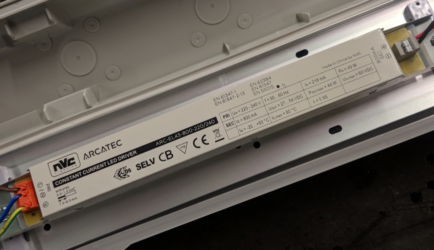 NVC 'Arcatec' LED driver

A look inside an NVC Greenland 5ft 36w LED weatherpack reveals it has this NVC branded driver. Previously NVC battens used Osram drivers, so it's interesting to see their own branded stuff fitted now.

I noticed these fittings in the workshop at work so thought I'd take a closer look at them before they get installed to see what makes them tick.

A quick look on the NVC website confirms these fittings are rated to last 50,000 hours in an ambient temperature of 25 degrees C. I know where these are going and the ambient temperature is probably somewhere around there in winter, much higher in the summer so it'll be interesting to see how long they last.
