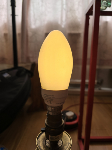 GE Biax 9w candle CFL bulb lit up
Here is the GE Biax candle bulb lit up 
