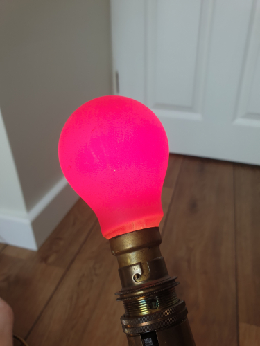 Unknown vintage GLS bulb lit up 
Here is that unknown vintage red coloured GLS incandescent bulb lit up
