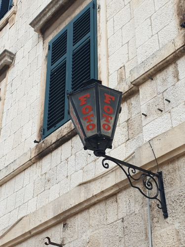 FOTO vintage outdoor light establishment sign 
In Kotor, Montenegro 

Sadly the shop was nonexistent 
