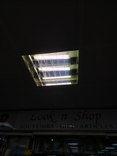 Recessed troffer light with 3x PL fluorescent 36W long CFLs 
Outside a souvenir shop in the shopping centre in Maspalomas city centre 
