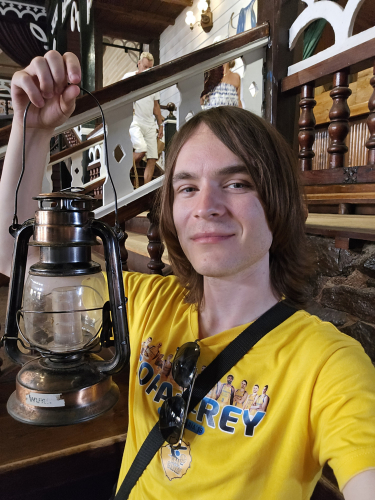 Me holding the hurricane oil light that's basically an LED torch 
At the Sioux City saloon bar 
