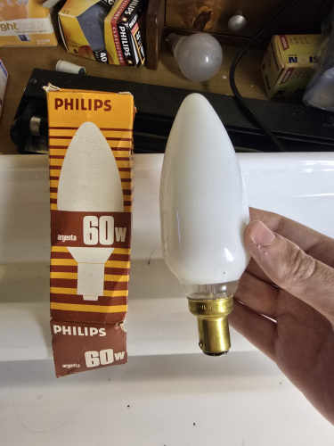 Philips Argenta Silverlight 60W candle bulb 
Got 2x of these from Aladdins Cave shop in Newbury, Berkshire

The difference to the OSRAM ones is that the coating on the Argentas has the clearband around the base area
