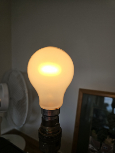 Crompton Triple Life 60W pearl GLS incandescent bulb lit up
As you'd expect, the brightness is significantly reduced that it is like somewhere around 40W of brightness 

The energy grade rating is F which is slightly better than the G rating that longlife incandescents tend to get 
