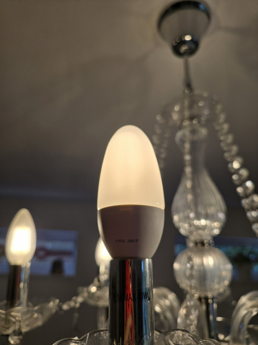 Philips 8W candle CFL lit up
You can see how it has the stick tubing instead of spiral inside 
