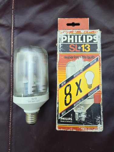 Philips SL*13 Prismatic CFL 
From car boot sale today

1st gen white base 
Made in Holland 
13W 
