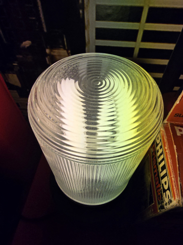 Philips SL*13 Prismatic CFL lit up 
Top view of the Philips SL*13 Prismatic CFL lit up
