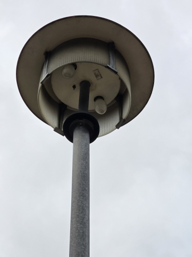Open drum shaped MV posttop fixture 
Couple of stations of the Harz Mountains narrow gauge railway has these vintage MV posttop open drum shaped fixtures 
