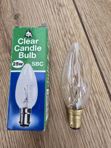 BELL 25W clear candle bulb
From car boot sale 

Has a brass base 
