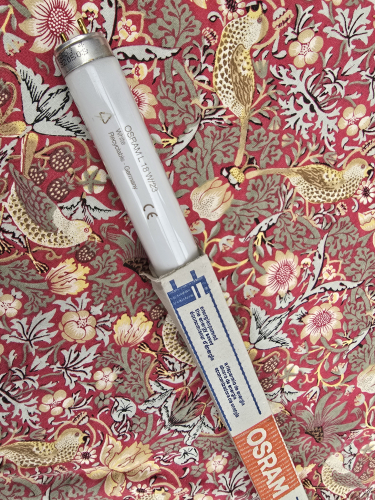 OSRAM L 18W/23 fluorescent tube
OSRAM 18W tube that is colour 23 

Not sure when it was made but I think around the early 2000s 
