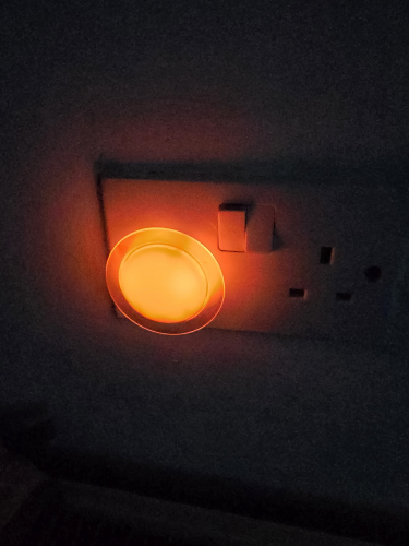 Neon plug in nightlight at my Aunts house
This is at the kitchen at my Aunts house 
