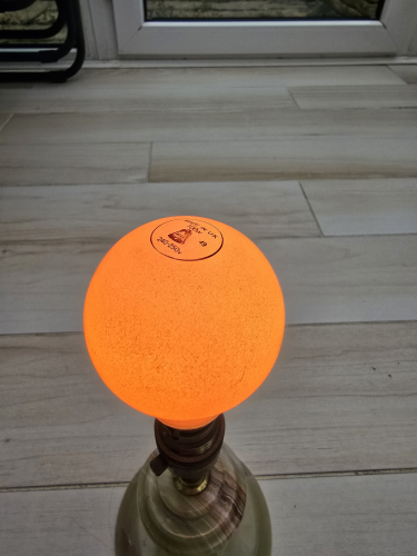 BELL 100W Wimbledon made pink ceramic coated bulb
Externally ceramic coated and says Made in UK along with the original BELL logo and the date code as 49


