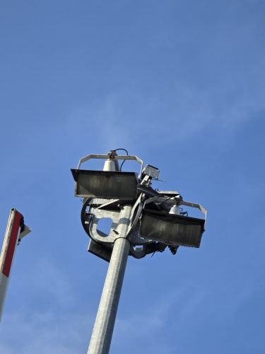 Wide-Lite style floodlights in Brockenhurst, Hampshire 
On our way to Isle of Wight- we had to stop at the level crossing at Brockenhurst town in Hampshire 

Right by the level crossing was this bunch of Wide Lite style floodlights 
