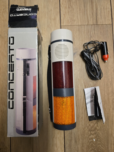 Concerto (Maxim) multi light source torch 
Got this from Sunday car boot sale 

It has an incandescent front, a fluorescent side and of course the red n yellow warning lights plus it has a siren built in too

It uses the power of a 12v car charger 
