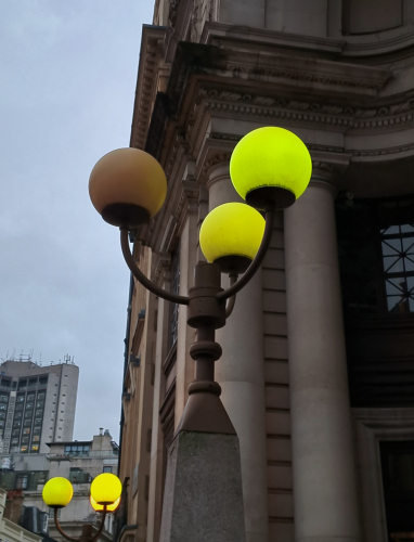 Well-worn mercury globe lanterns
Some rather nice and nostalgic-looking mercury globes dimly illuminating the entrance of a large building in central London.
