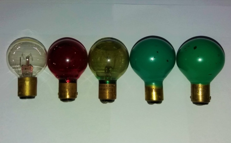 Assorted switchboard indicator lamps
All 10w and 50v. From left to right: clear (Osram-GEC), red and green lacquer (Siemens/Ediswan), 2x green (Philips and Cryselco-GEC).
