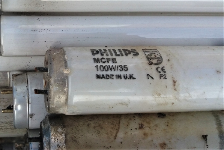 Strange Philips 100w tube made by GE
This photo was taken at the lamp recycling pile. I didn't take this lamp, as the pins were damaged, it looked EOL and I can't really be bothered with 8ft tubes anymore unless they are something very rare.
