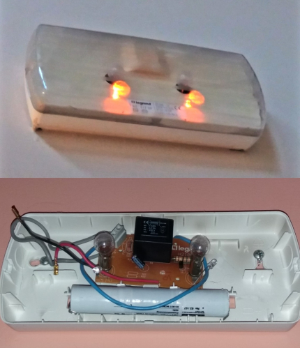 Typical older European incandescent emergency light
From a hotel I'm staying at at the moment in Spain. These fittings were very popular as emergency lights along with the T5 fluorescent versions more commonly seen. They contain 2 torch-style incandescent lamps and 2 amber indicator LEDs. As a bonus there was one in my room actually missing the cover!
